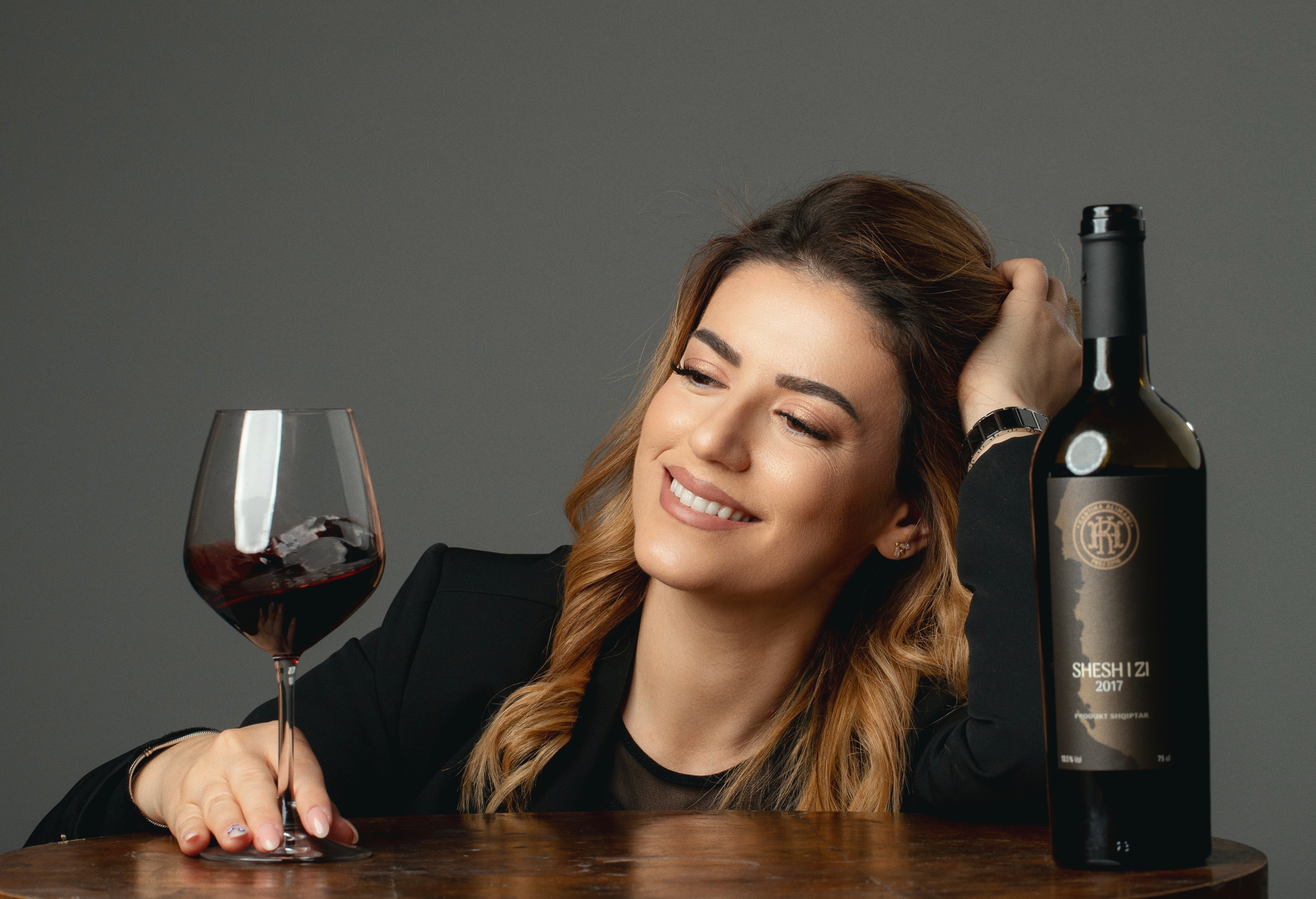 Alimani Winery Ambassador with red wine Shesh i zi